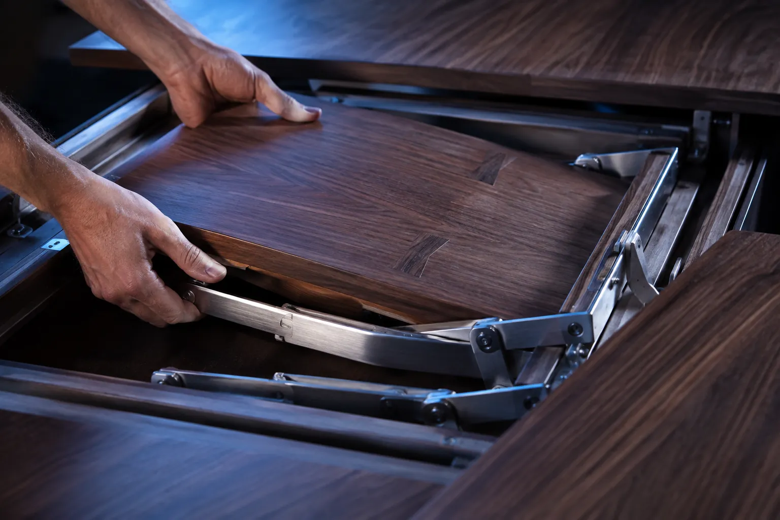 Close view of a butterfly leaf dining table mechanism
