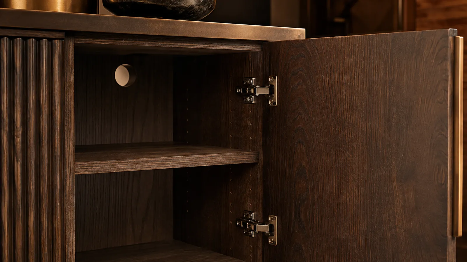 Open sideboard showing an adjustable shelf hinge and cable outlet
