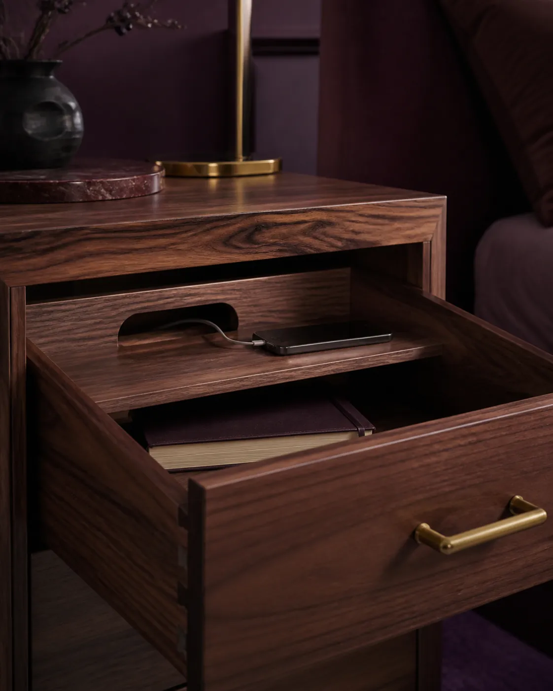 Open walnut bedside drawer with cable channel and charging shelf