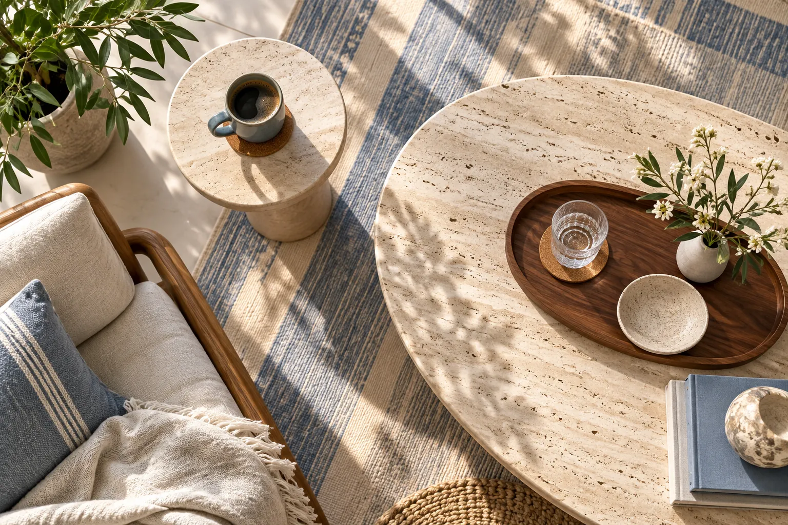 Illustrative overhead view of a stone side table with a tray and coasters protecting its surface