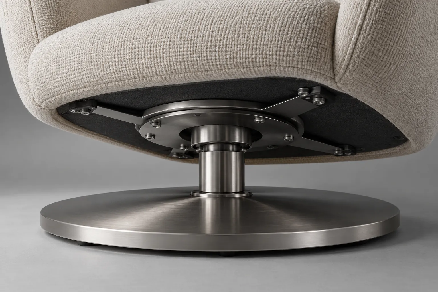 Close view of a generic chair pivot and brushed steel swivel base